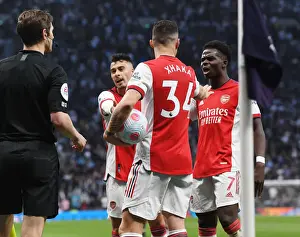Arsenal's Martinelli, Xhaka, and Saka in Action against Tottenham in the Premier League