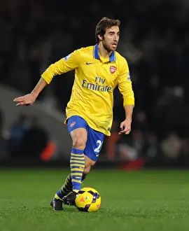Arsenal's Mathew Flamini in Action: Premier League Battle against West Ham United (December 2013)
