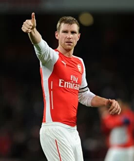 Images Dated 13th December 2014: Arsenal's Per Mertesacker Celebrates with Fans after Arsenal v Newcastle United Win, 2014/15