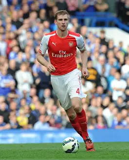 Chelsea V Arsenal 2014-15 Prints: Arsenal's Per Mertesacker at Chelsea's Stamford Bridge: Premier League Clash 2014-15