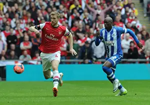 Arsenal's Per Mertesacker Faces Off Against Wigan's Marc-Antoine Fortune in FA Cup Semi-Final Showdown