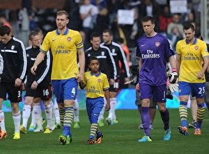 Images Dated 24th August 2013: Arsenal's Per Mertesacker and the Gunners Mascot Before Fulham Clash (2013-14)