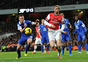 Arsenal V Everton 2013-14 Prints: Arsenal's Per Mertesacker Outruns Everton's James McCarthy during Premier League Clash