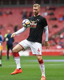 Arsenal's Per Mertesacker Secures 2-0 Victory Over Brighton in Premier League