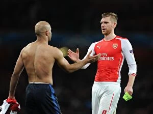 Images Dated 25th February 2015: Arsenal's Per Mertesacker Shakes Hands with Monaco's Aymen Abdennour during Champions League Clash