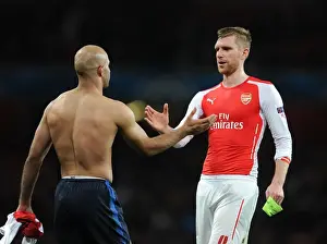 Arsenal V Monaco 2104/15 Prints: Arsenal's Per Mertesacker Shakes Hands with Monaco's Aymen Abdennour during Champions League Clash