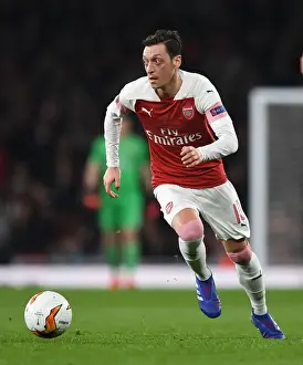 Arsenal V BATE Borisov 2018-19 Prints: Arsenal's Mesut Ozil in Action against BATE Borisov in the Europa League Round of 32 (2018-19)