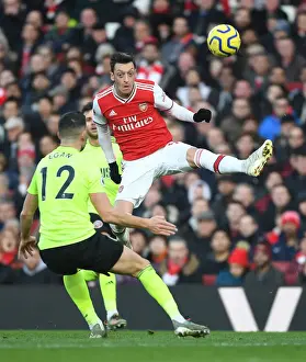 Arsenal V Sheffield United 2019-20 Prints: Arsenal's Mesut Ozil Clashes with Sheffield United's John Egan in Premier League Showdown