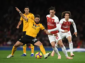 Arsenal V Wolverhampton Wanderers 2018-19 Prints: Arsenal's Mesut Ozil Clashes with Wolves Joao Moutinho in Premier League Showdown