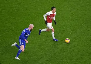 Arsenal V Cardiff City 2018-19 Prints: Arsenal's Mesut Ozil Faces Off Against Cardiff's Aron Gunnarsson in Premier League Clash