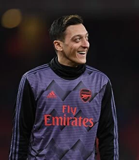 Images Dated 7th January 2020: Arsenal's Mesut Ozil Warming Up Ahead of FA Cup Clash Against Leeds United