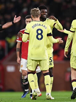 Manchester United v Arsenal 2020-21 Collection: Arsenal's Midfield Dynamo: Thomas Partey and Martin Odegaard in Action against Manchester United