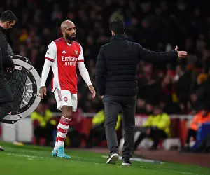 Arsenal V Liverpool 2021-22 Prints: Arsenal's Mikel Arteta and Alex Lacazette: A Tactical Duo in Arsenal vs