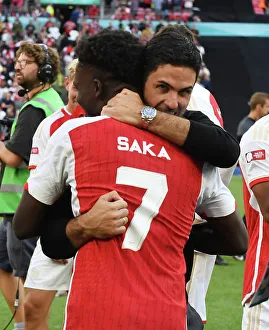 Arsenal V Manchester City - Community Shield 2023-24 Prints: Arsenal's Mikel Arteta and Bukayo Saka Celebrate FA Community Shield Victory over Manchester City