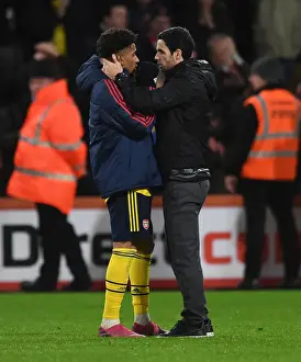 Arsenal's Mikel Arteta Celebrates with Reiss Nelson after AFC Bournemouth Win