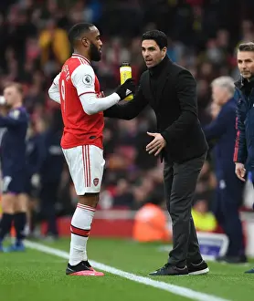 Arsenal V West Ham United 2019-20 Prints: Arsenal's Mikel Arteta Coaches Alexis Lacazette Amid Intense Arsenal v West Ham United Clash (2019-20)