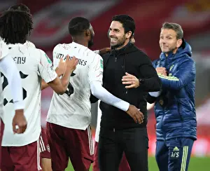 Arsenal's Mikel Arteta Embraces Ainsley Maitland-Niles in Empty Anfield: Carabao Cup Showdown Between Liverpool and Arsenal, 2020-21