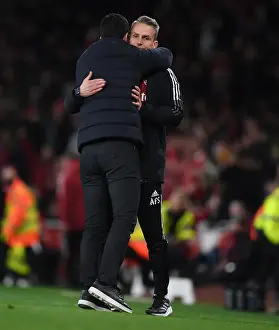 Arsenal's Mikel Arteta Embraces Assistant Coach Albert Stuivenburg After Arsenal v West Ham United Win