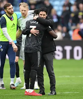 Arsenal's Mikel Arteta Embraces Bukayo Saka in Victory at Aston Villa, Premier League 2022-23