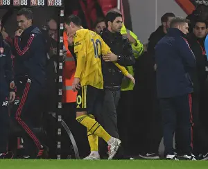 Arsenal's Mikel Arteta Embraces Mesut Ozil After Substitution during AFC Bournemouth vs Arsenal (2019-20)