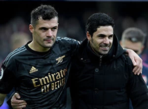 Images Dated 12th March 2023: Arsenal's Mikel Arteta and Granit Xhaka Celebrate Victory over Fulham in Premier League 2022-23