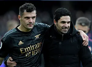 Arsenal's Mikel Arteta and Granit Xhaka Celebrate Victory over Fulham in Premier League 2022-23