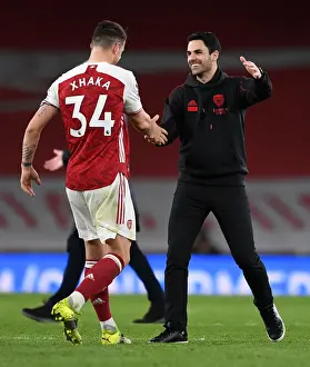Arsenal's Mikel Arteta and Granit Xhaka Celebrate Victory Over Tottenham
