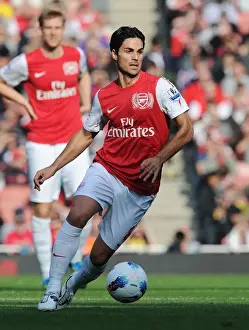Arsenal's Mikel Arteta Leads the Way: 3-1 Victory Over Stoke City in the Premier League (2011-2012)
