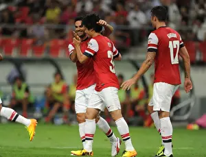 Nagoya Grampus V Arsenal 2013-14 Prints: Arsenal's Miyaichi, Arteta, and Giroud Celebrate Goals Against Nagoya Grampus in 2013