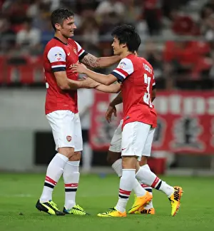 Nagoya Grampus V Arsenal 2013-14 Prints: Arsenal's Miyaichi and Giroud Celebrate Goals in Nagoya Grampus Match, 2013
