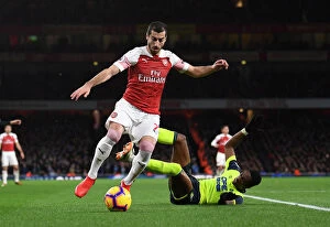 Images Dated 8th December 2018: Arsenal's Mkhitaryan Clashes with Huddersfield's Kongolo in Premier League Showdown