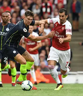 Arsenal V Manchester City 2018-19 Prints: Arsenal's Mkhitaryan Clashes with Manchester City's Stones in Premier League Showdown