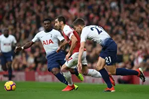 Arsenal's Mkhitaryan Clashes with Tottenham's Aurier and Foyth in Premier League Showdown