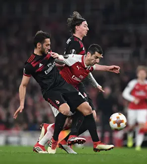 Arsenal V AC Milan 2017-18 Prints: Arsenal's Mkhitaryan Goes Head-to-Head with Calhanoglu and Montolivo of AC Milan in Europa League Showdown
