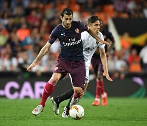 Images Dated 9th May 2019: Arsenal's Mkhitaryan Outmaneuvers Valencia's Gabriel in Europa League Semi-Final Showdown