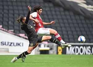 Arsenal's Mo Elneny Faces Off Against MK Dons David Kasumu in Pre-Season Friendly