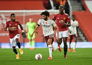 Manchester United V Arsenal 2020-21 Prints: Arsenal's Mo Elneny Outsmarts Paul Pogba: A Battle in Empty Old Trafford