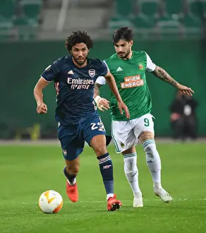 Rapid Vienna V Arsenal 2020-21 Prints: Arsenal's Mo Elneny Overpowers Rapid Wien's Taxiarchis Fountas in Europa League Clash
