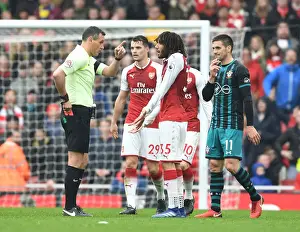 Arsenal V Southampton 2017-18 Prints: Arsenal's Mo Elneny Receives Red Card from Referee Andre Marriner in Arsenal v Southampton (2017-18)