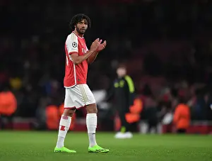 Arsenal's Mohamed Elneny Celebrates with Fans after Securing Group B Win vs Sevilla FC, UEFA Champions League 2023/24