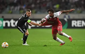 Qarabag V Arsenal 2018-19 Prints: Arsenal's Mohamed Elneny Faces Off Against Qarabag's Mikael in Europa League Clash
