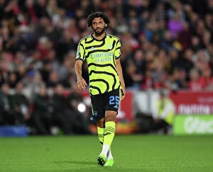 Images Dated 27th September 2023: Arsenal's Mohamed Elneny Watches Brentford-Arsenal Carabao Cup Clash, 2023-24