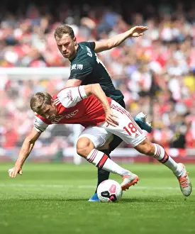 Arsenal's Monreal Clashes with Burnley's Barnes in Premier League Showdown