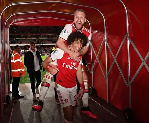 Arsenal's Mueller-Wancks and David Celebrate Goal Against Everton in Premier League Match