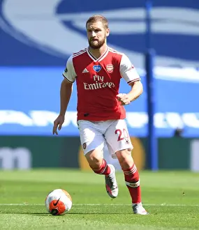 Brighton And Hove Albion V Arsenal 2019-20 Prints: Arsenal's Mustafi at Empty Brighton Stadium: Premier League Match Amid Coronavirus Pandemic