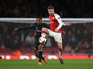 Arsenal V CSKA Moscow 2017-18 Prints: Arsenal's Mustafi Clashes with Musa in Europa League Quarterfinal