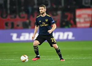 Olympiacos V Arsenal 2019-20 Prints: Arsenal's Mustafi Faces Off Against Olympiacos in Europa League Clash