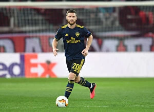 Olympiacos v Arsenal 2019-20 Collection: Arsenal's Mustafi Faces Olympiacos in Europa League Showdown