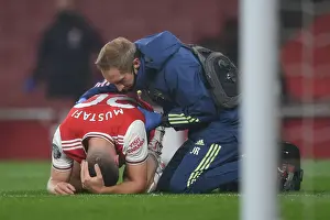 Arsenal V Leicester City 2019-20 Prints: Arsenal's Mustafi Receives Treatment During Arsenal v Leicester City Premier League Match