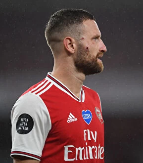 Arsenal v Leicester City 2019-20 Collection: Arsenal's Mustafi Suffers Facial Injury in Arsenal vs. Leicester City Clash (2019-20)